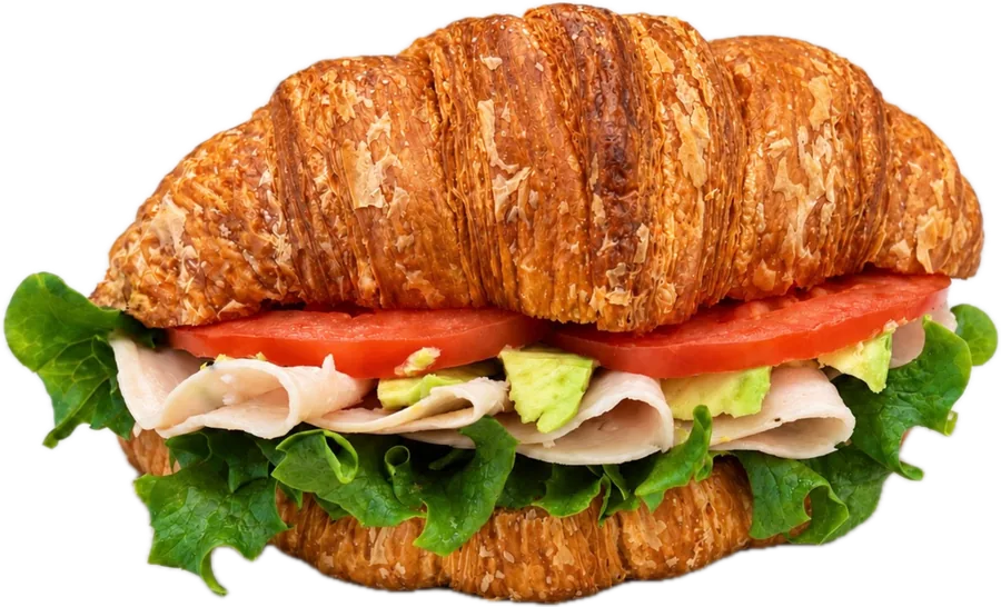 Turkey Pesto Croissant sandwich with avocado and tomato at Maison Croissant & Bowls on St Anne's Rd, Winnipeg